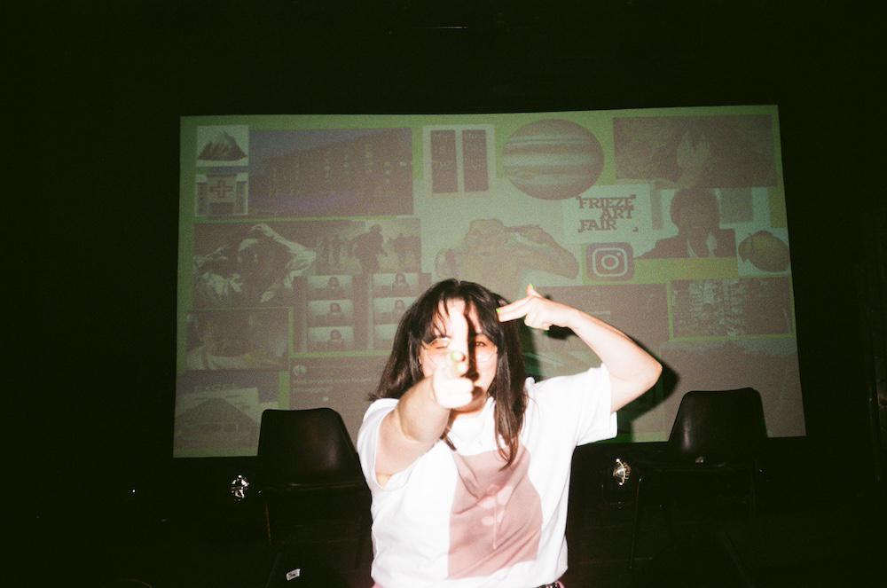 gab has two hands in the shape of guns, one is pointing at the camera and one is pointing at her own head