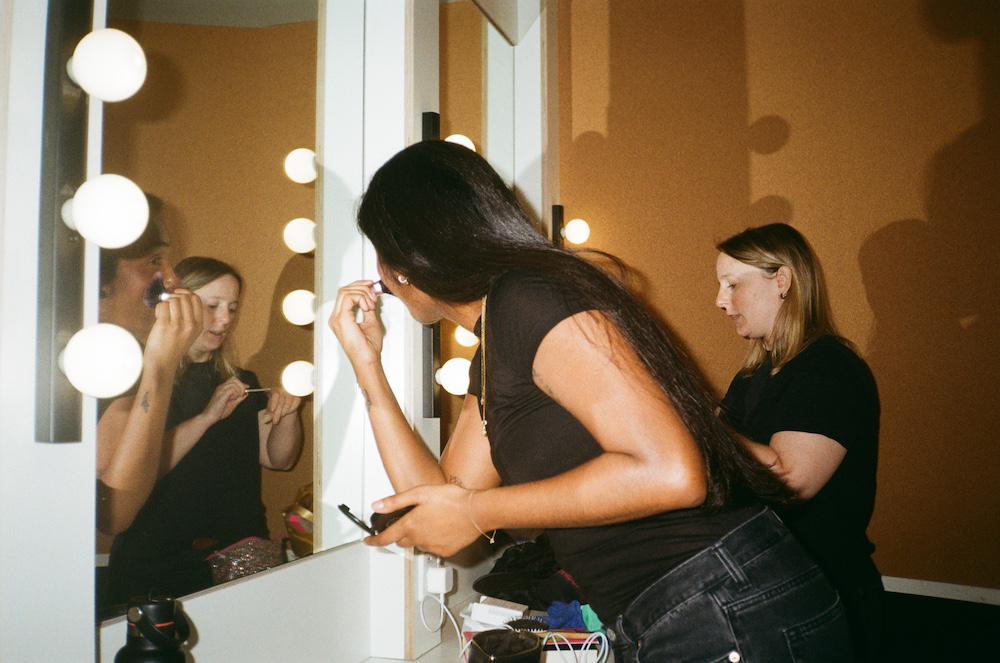 abi palmer and zarina doing their makeup in the green room at the ICA