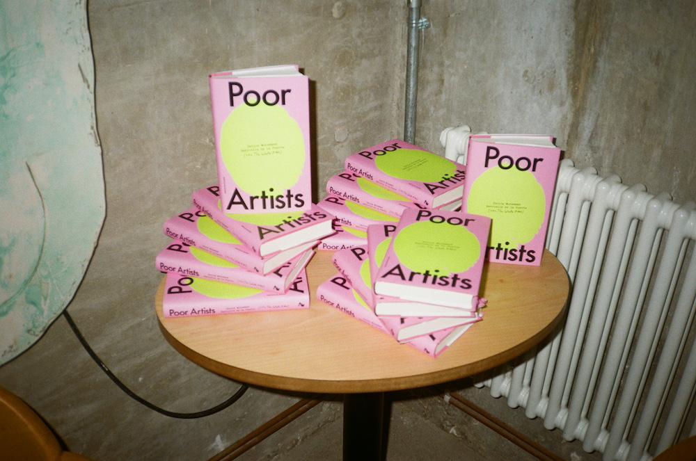 a carefully arranged stack of poor artists books