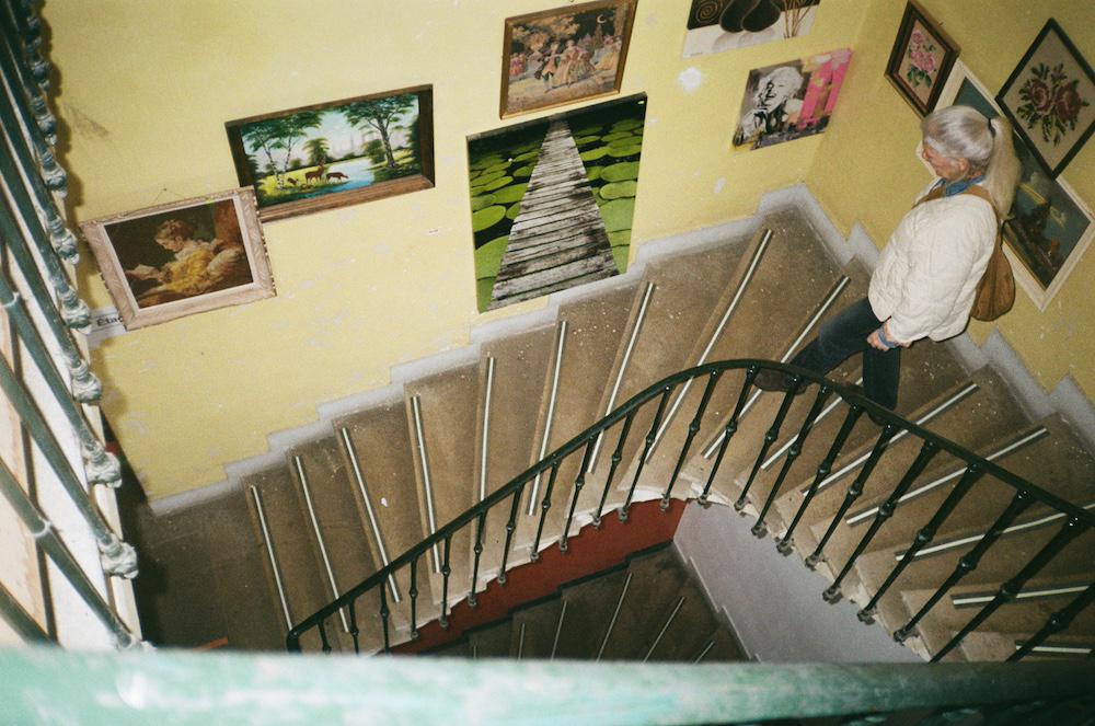Anita walking down the stairs in Emmeus, a flea market type place