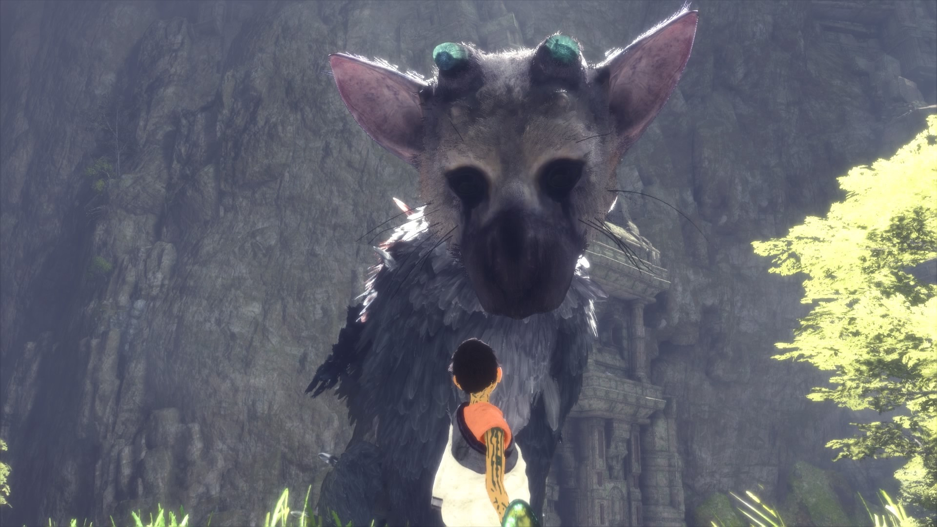 a tiny child looks up at a big grey creature that looks like a grey cat, bird-like, pinkish ears, broken blue horns, and black marks below its eyes like a clown
