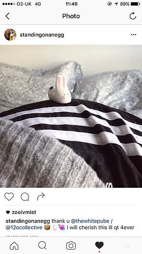 a small bunny rabbit figure is on the edge of someone&rsquo;s hip as they lie down