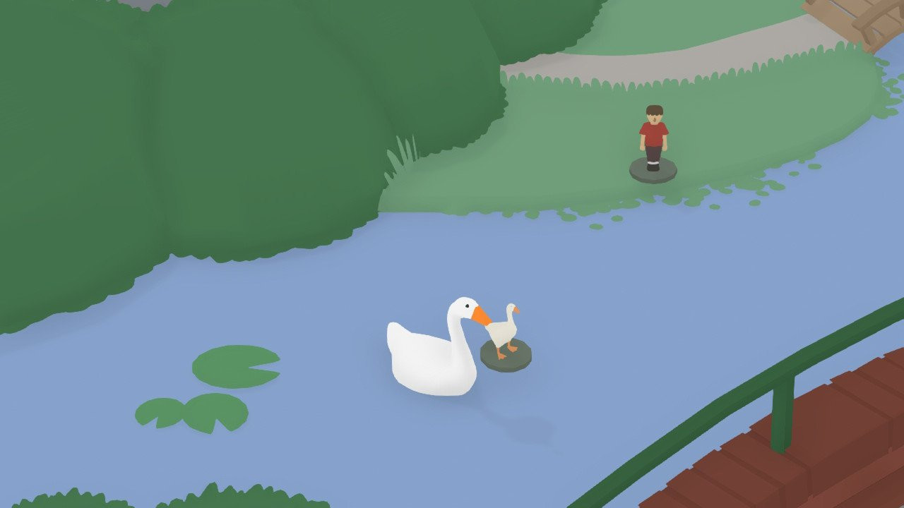 the goose is in a little stream holding a tiny model of a goose in its mouth