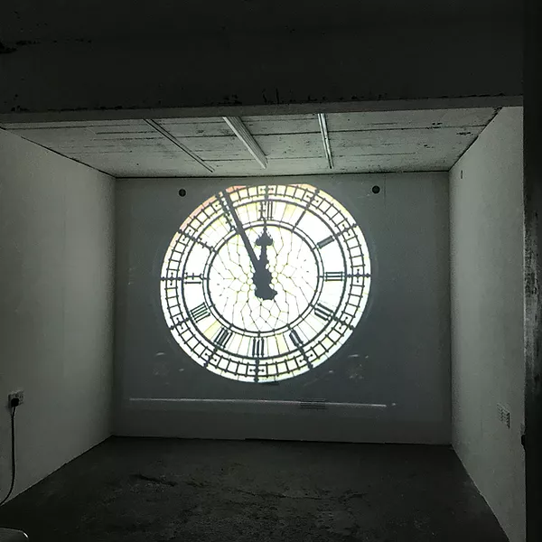 a close up of big ben as the clock reaches midnight