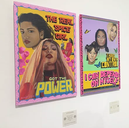 two paintings in the style of posters, one saying &lsquo;the real spice girl, got the power&rsquo; with two brown woman one wearing a long veil, and the second says &lsquo;I have my own control. I can depend on myself&rsquo; and it is three heads against colour and butterflies'