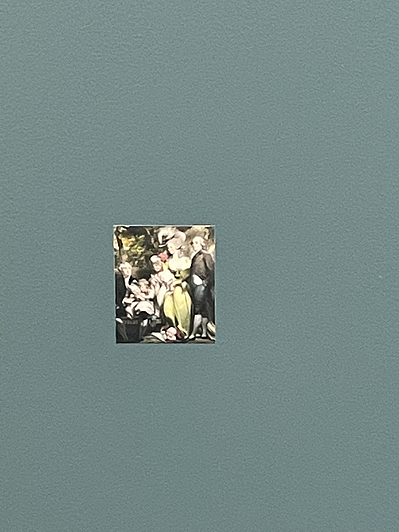 a small painting of a white family is stuck on a wall against a grey teal background