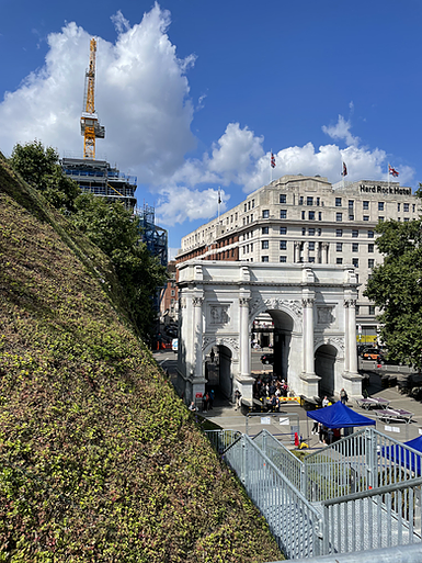 while walking up  the stairs, zarina looks over at marble arch which is eye level now and there&rsquo;s a crane in the background