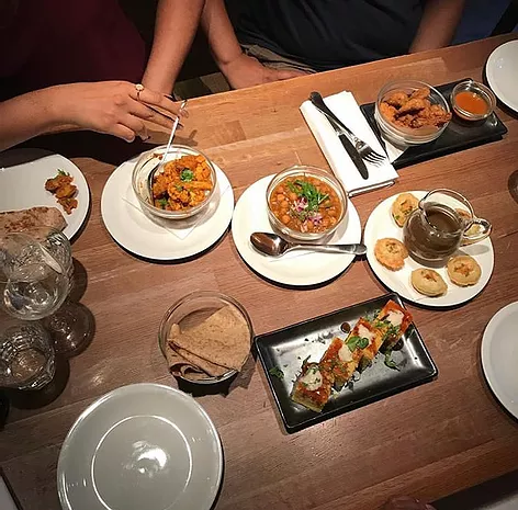 the photo is taken from high above the table so many dishes are visible