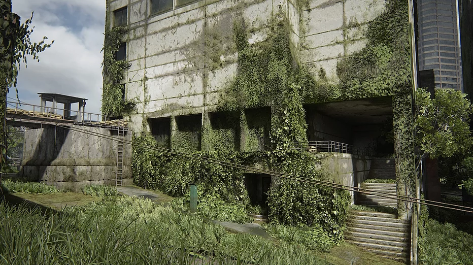 buildings covered in overgrowth, plants running up the side of them, falling apart