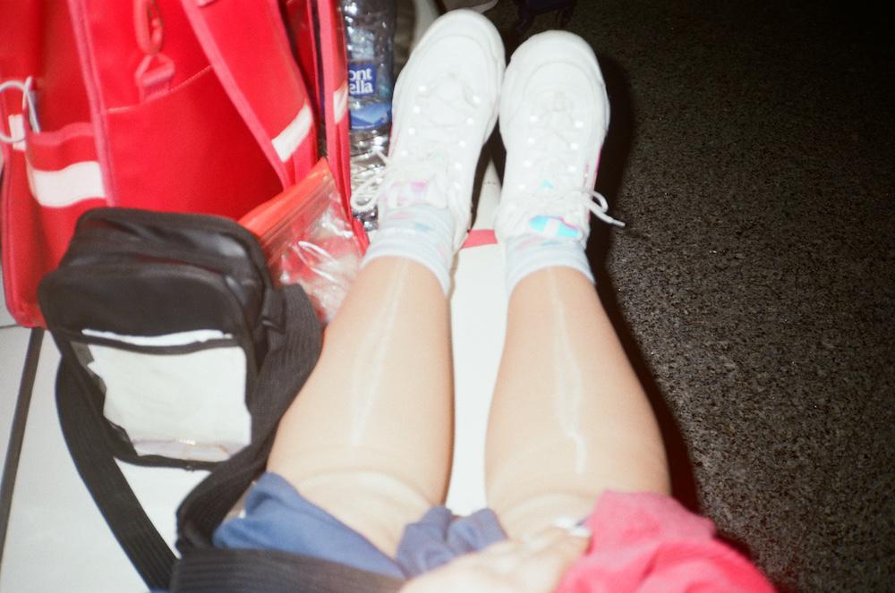 gabs legs in shiny compression stockings waiting in the airport in bilbao